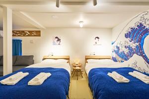 Tempat tidur dalam kamar di IZURU Shiba Hamamatsucho 3F