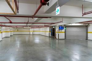 an empty garage with a garage door and a parking lot at GOGO Hotel 市政館 in Taichung