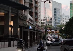 a group of motorcycles parked on a city street at Stylish New Studio at McKinley Hill BGC Free Netflix in Manila