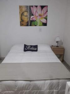 Postel nebo postele na pokoji v ubytování Los Colibríes + 3 fotografie