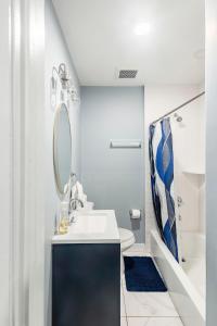 a bathroom with a sink and a mirror at Prime Location Explore NYC in West New York +13 photos
