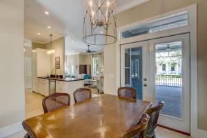 a kitchen and dining room with a wooden table and chairs at 1016 San Fernando Street home in Fernandina Beach