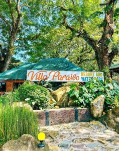 a sign for the zoo parasos resort and spa at Villa Paraiso Resort & Waterpark in Bokbok