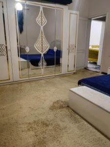 a bedroom with a bed and a mirror at travel adventures 