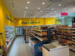 a grocery store aisle with a bunch of products at City Of Green near Bukit Jalil Cozy 7pax 3R2B in Seri Kembangan
