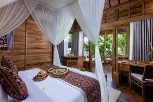 Letto o letti in una camera di Edge of Ubud by Pramana Villas