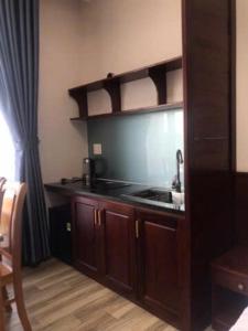 a kitchen with a sink and a counter top at Moonlight House in Da Thanh