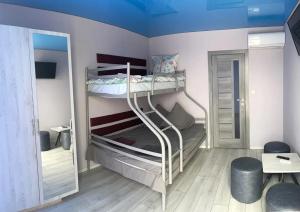 a small room with two bunk beds in it at Міні-готель аквапарку Европа in Solomonovo