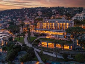 an aerial view of a building at dusk at Hotel Continental in Santa Margherita Ligure