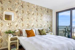 Ένα ή περισσότερα κρεβάτια σε δωμάτιο στο Ocean View Oasis Austinmer