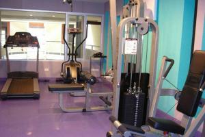 a gym with a treadmill and a mirror at Palette Bella B All Suites Bangkok Hotel in Bangkok