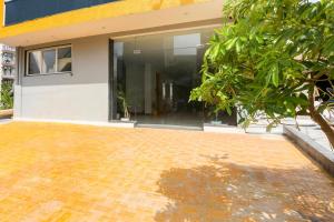 a brick driveway in front of a building at Super Townhouse Sector 69 Gurgaon in Gurgaon +29 photos