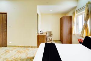 Postel nebo postele na pokoji v ubytování Super Hotel O Sriperambadhur formerly Radha Residency