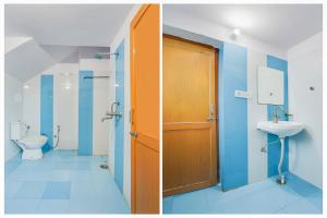 a bathroom with a toilet and a sink at Super Hotel O JLN Marg Malviya Nagar Formerly Hotel Braj Haveli in Jaipur +24 photos