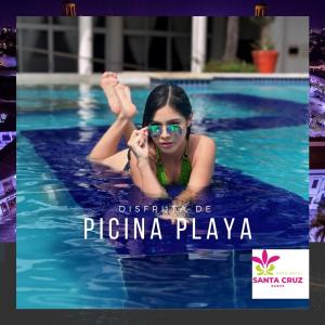 a young girl swimming in a swimming pool at Gran Hotel Santa Cruz in Santa Cruz de la Sierra