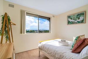 Ένα ή περισσότερα κρεβάτια σε δωμάτιο στο Rosehill Retreat Near Parramatta with Parking +18 φωτογραφίες