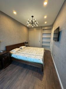 Ένα ή περισσότερα κρεβάτια σε δωμάτιο στο The Filmore Luxury Apartment