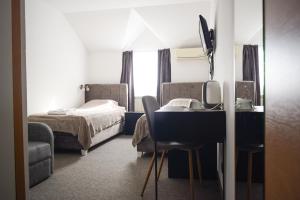 Postel nebo postele na pokoji v ubytování Hotel Tiski Cvet