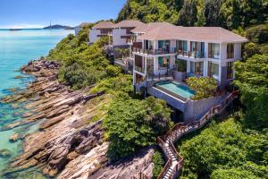 an aerial view of a house on a cliff at Premier Village Phu Quoc Resort Managed by Accor in Phu Quoc