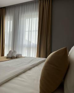 Voodi või voodid majutusasutuse Alko Hotel Bushat toas