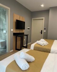 Voodi või voodid majutusasutuse Alko Hotel Bushat toas