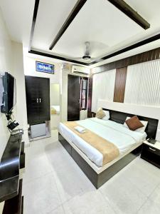 TV a/nebo společenská místnost v ubytování Hotel Kailash Residency