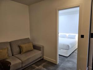 O zonă de relaxare la Suite Aromas del Califato 6 huésped