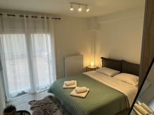 Ένα ή περισσότερα κρεβάτια σε δωμάτιο στο Kallia apartment