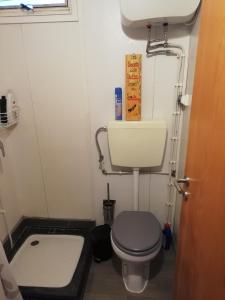 a small bathroom with a toilet and a sink at Monte da Luz in Alqueva +42 photos