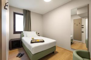 Postel nebo postele na pokoji v ubytování Energy Park Hotel