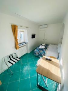 Postel nebo postele na pokoji v ubytování Antico Borgo