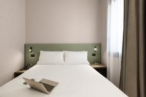 Postel nebo postele na pokoji v ubytování Energy Park Hotel