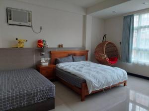 Voodi või voodid majutusasutuse 曼巴小棧 toas
