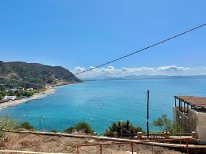 a view of a beach and the ocean at Irini Panorama in Agia Galini