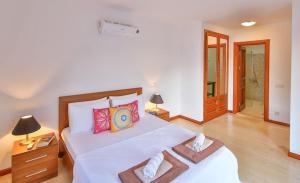 a bedroom with a bed with two towels on it at Villa Nane in Kaş +32 photos