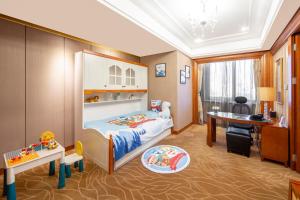 Postel nebo postele na pokoji v ubytování Sofitel Harbin