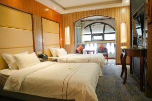 Postel nebo postele na pokoji v ubytování Cavalier Hotel Chongqing