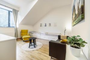 a living room with a couch and a bed at Jasmínový Ráj in Vítkovice