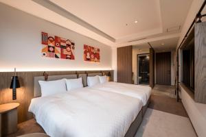 Postel nebo postele na pokoji v ubytování CINQS Hotel + 32 fotografií