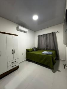 Ένα ή περισσότερα κρεβάτια σε δωμάτιο στο Premium