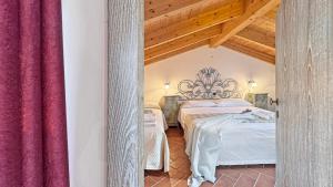 Postel nebo postele na pokoji v ubytování Dimora Agnese