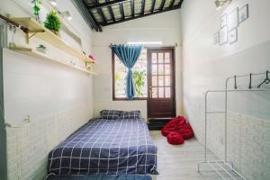 Postel nebo postele na pokoji v ubytování BKV Homestay