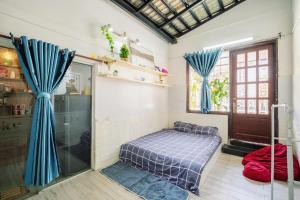 Postel nebo postele na pokoji v ubytování BKV Homestay