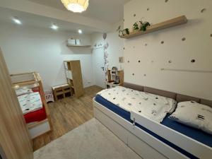 Postel nebo postele na pokoji v ubytování La Petite Maison