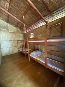 Postel nebo postele na pokoji v ubytování Sitio tourist inn