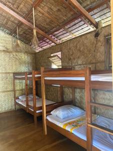 Postel nebo postele na pokoji v ubytování Sitio tourist inn