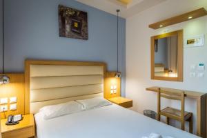 Postel nebo postele na pokoji v ubytování Pantheon Hotel