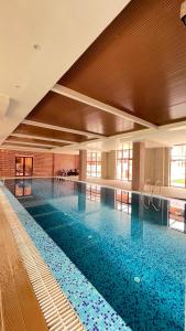 Bazén v ubytování Hotel Ashwatth nebo v jeho okolí