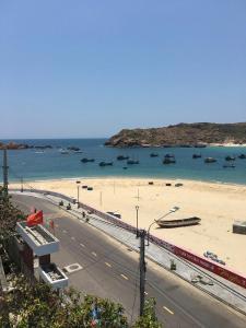 a view of a beach with boats in the water at Nhà Nghỉ Phát Lợi in Quy Nhon