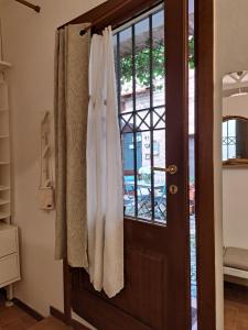 a door with white towels hanging on it at Nel vicolo dei Baci - Casa vacanze al Bacio in Spello +82 photos